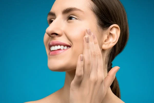 an image of a woman showing off her bright smile